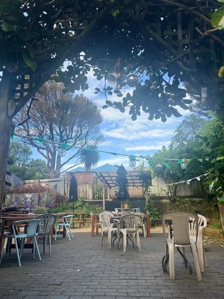Outdoor courtyard seating with tables and chairs