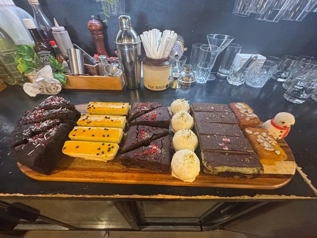 Board of house-baked slices and sweets